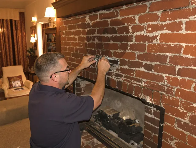 Melbourne Chimney Sweep expert fixing a fireplace in Melbourne, FL